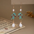 Detail of New Chinese style butterfly earrings with white pearls and turquoise glaze finish - E6417 (Gold Leaf/Enamel/Red Bead/White Drop)