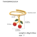 Detailed macro view of cherry charm ring with red enamel and zircon on gold steel - US 7 / Gold Cherry Ring