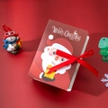 Scatola di caramelle natalizia stile libro magico con Babbo Natale e fiocco rosso - Con Nastro Rosso / Babbo Natale che Consegna Regali