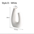 Modern white U-shaped ceramic vase with a matte finish and geometric twisted design - White - Style D (Modern U-Shape)