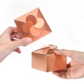 Rose gold laser paper gift box featuring a unique four-leaf clover shaped interlocking seal - Rose Gold