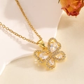 Elegant gold bow necklace featuring shimmering zircon crystals and pearl shell details - Gold Hollow Bowknot Four Diamond Necklace