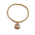 Gold beaded bracelet featuring a round star pendant with colorful crystals on white background - Round Starburst with Colored Zircon