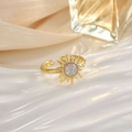 Macro shot of gold sunburst ring featuring a shimmering round opal center on white fabric - JZ0101B-Gold Light Purple Opal Sun