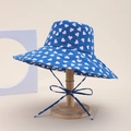 Navy blue reversible sun hat with pink heart patterns and adjustable drawstring - Heart Style / Blue