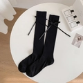 Black knee-high socks featuring vertical rib knit texture and side ribbon bows decor - Bowknot Style / Black