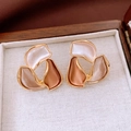 Close-up of abstract flower stud earrings with gold plating in a luxury jewelry box - Gold-Multicolor (Stitched Abstract)