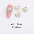 Macro view of 12x10mm golden butterfly nail art alloy charms with inlaid rhinestones - Clear Butterfly with Gold Base (A757)