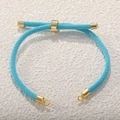 Detail of blue Milanese woven cord bracelet with adjustable gold-plated slider and end caps - Teal