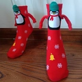 Red Christmas novelty socks with 3D penguin pattern and magnetic holding hands feature - Red Knitted Penguin Bell