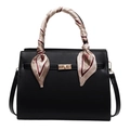 Elegant black leather handbag with a patterned silk scarf handle and gold twist lock clasp - Black