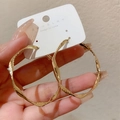 Close-up of luxury gold hammered twist hoop earrings worn to show size and texture - Large Twisted Hammered Style (E1493 Gold) / 925 Silver Needle / Gold