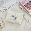 Close-up of white heart-quilted fabric with cute sheep embroidery and rope zipper pull - Sheep Bear (Heart)