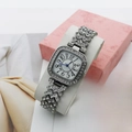 Elegant square silver ladies watch with crystal inlay and blue hands on white stand - Silver Numerals