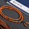 Thuja Sutchuenensis wood bead bracelet with orange-red grain and Chinese knot tassel - Aged Wood Old Shape Style