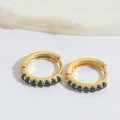 Detail of gold-plated hoop earrings featuring micro-set dark blue zircon gemstones - Sapphire Blue