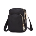 Three-layer black nylon crossbody phone bag with gold zippers and adjustable strap - Black