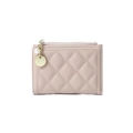 Detail of pink quilted wallet featuring a gold zipper and a pearl charm pendant - Apricot