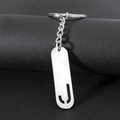 Polished silver stainless steel keychain with cutout capital letter J on rectangular tag - Letter J