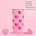 Detailed view of pink stainless steel tumbler with heart patterns and a clear sealing lid - 20oz Integrated Cup