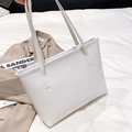 White faux crocodile skin tote bag with long shoulder straps for women on white bedding - White (Crocodile Pattern)