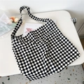Flat lay of checkerboard canvas tote bag with floral accents on a white desk - 22 Small Black & White Checkerboard