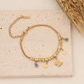 Collana in acciaio dorato con farfalla e malocchio, esposta su pietra con decoro di grano - 2# Braccialetto / Oro