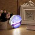 Macro detail of the round night light featuring a starry deer silhouette on a wood table - Good Night Hello / One-button Switch Warm Light Stepless Dimming