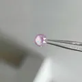 Sparkling pink round zircon titanium steel earring stud held by tweezers in macro view - 6mm Crystal Lavender (Single Piece)