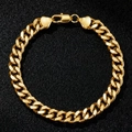 Chunky gold-plated stainless steel Cuban link bracelet with a heart lobster clasp design - Gold