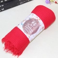Vibrant red cotton linen scarf with frayed edges and handcrafted tassel detail - Red