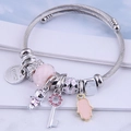 Adjustable silver wire bangle with pink beads, Fatima hand, and key charm charms - Pink