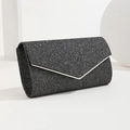 Sparkling black evening clutch bag with silver metal trim and elegant flap design - Black