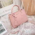Pink lychee textured PU leather handbag with top handles and adjustable strap - Pink