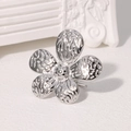 Macro detail of silver flower ring with textured hammered finish and open design - Hammered Petal Style (JR594-Steel Color)