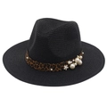 Detail of black straw hat featuring leopard print band with white pearls and small floral accent - Black