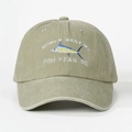 Close-up of Fish Fear Me embroidery and sailfish detail on washed olive baseball cap - One Size / Light Khaki