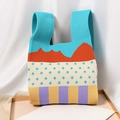Artistic knit tote bag featuring blue, orange, and beige color block patchwork - Blue Stripes On Mountains And Small Trees