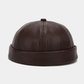 Detailed close-up showing the premium texture of the dark brown PU leather docker cap - Adjustable / Dark Brown