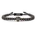 Men's black beaded leopard head bracelet with green eyes and adjustable woven cord - Black Leopard Head