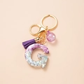 Letter G keychain with purple sequins, matching suede tassel and glitter ball pendant - Letter G