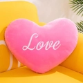 Close-up of a pink plush heart-shaped pillow with white Love embroidery on a sofa - 15cm / Rose Red