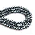 Macro shot of 8mm dark grey metallic imitation pearl beads with smooth polished finish - 10mm / Dark Gray