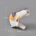 Calico cat resin figurine in licking pose, measuring 3.4cm in height and 3.3cm in length - No.15 Lazy Calico Cat