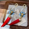 2511083a Red Bull Horn Earrings