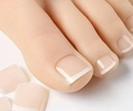 French tip toe press-on nails in nude and white color showing natural wearing effect - FW36