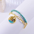 Bracciale a doppio strato con perline turchesi e catena d'oro con ciondoli palma e delfino - Bracciale