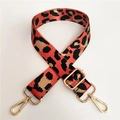Close-up of leopard print bag strap with golden metal hooks and adjustable buckle - Silver Clasp / Orange