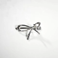 Silver alloy hollow knot bow hair clip with textured metallic finish and duckbill grip - Bow