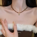 Detail of beaded necklace with star sun pendant on neck to show length and texture - 17# Oval Gemstone Pendant Beaded Necklace (Gold-Coffee) (5650032047145)